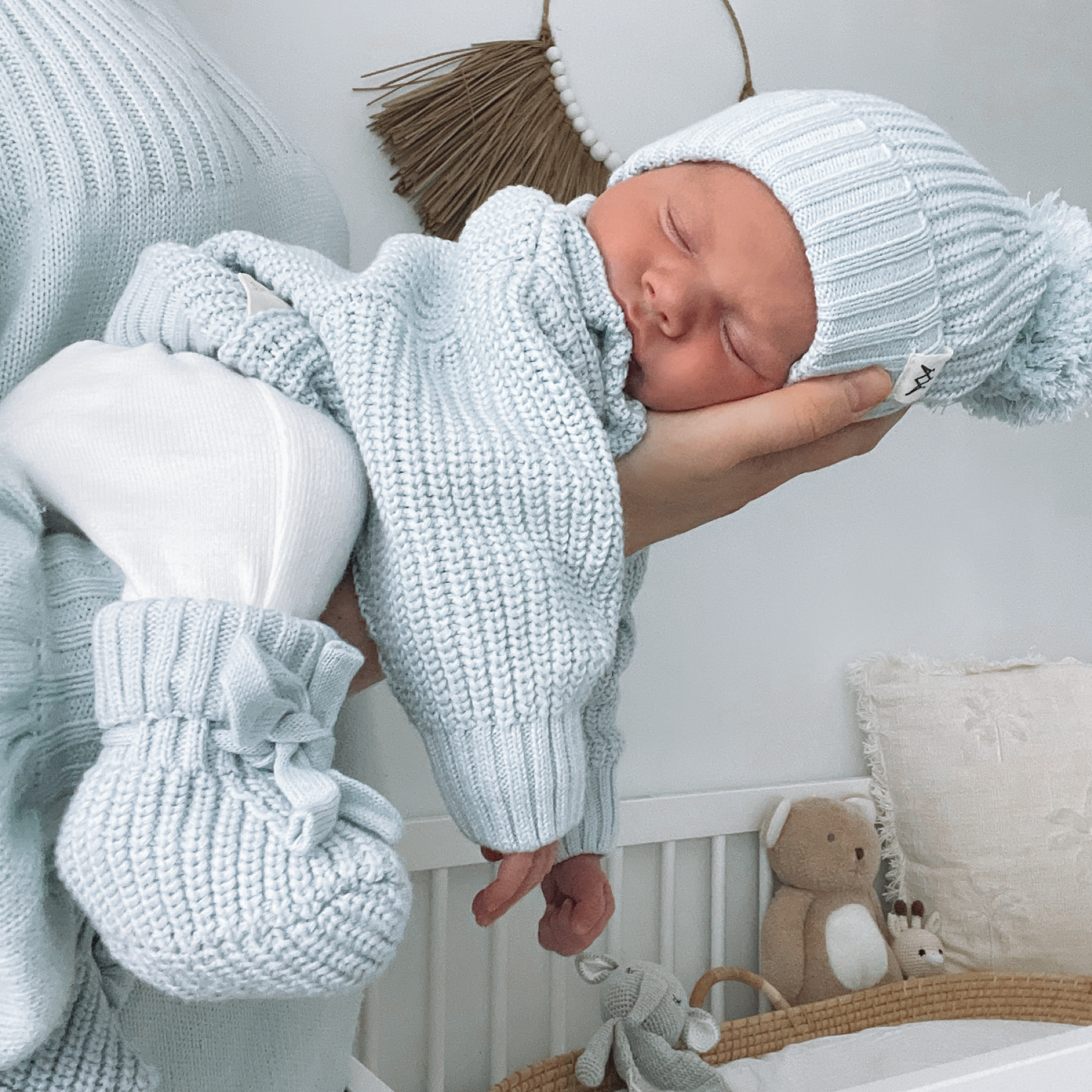 Knitted newborn outfit from the 3 Little Crowns collection